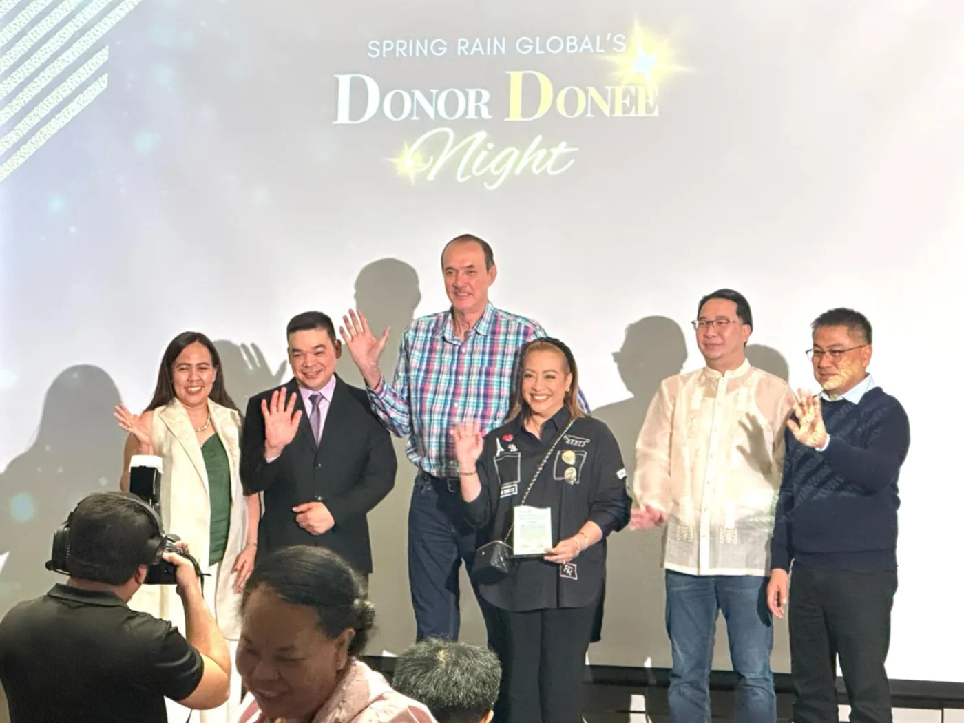 Mon and Karla Fernandez receiving recognition at a Bangkok event
