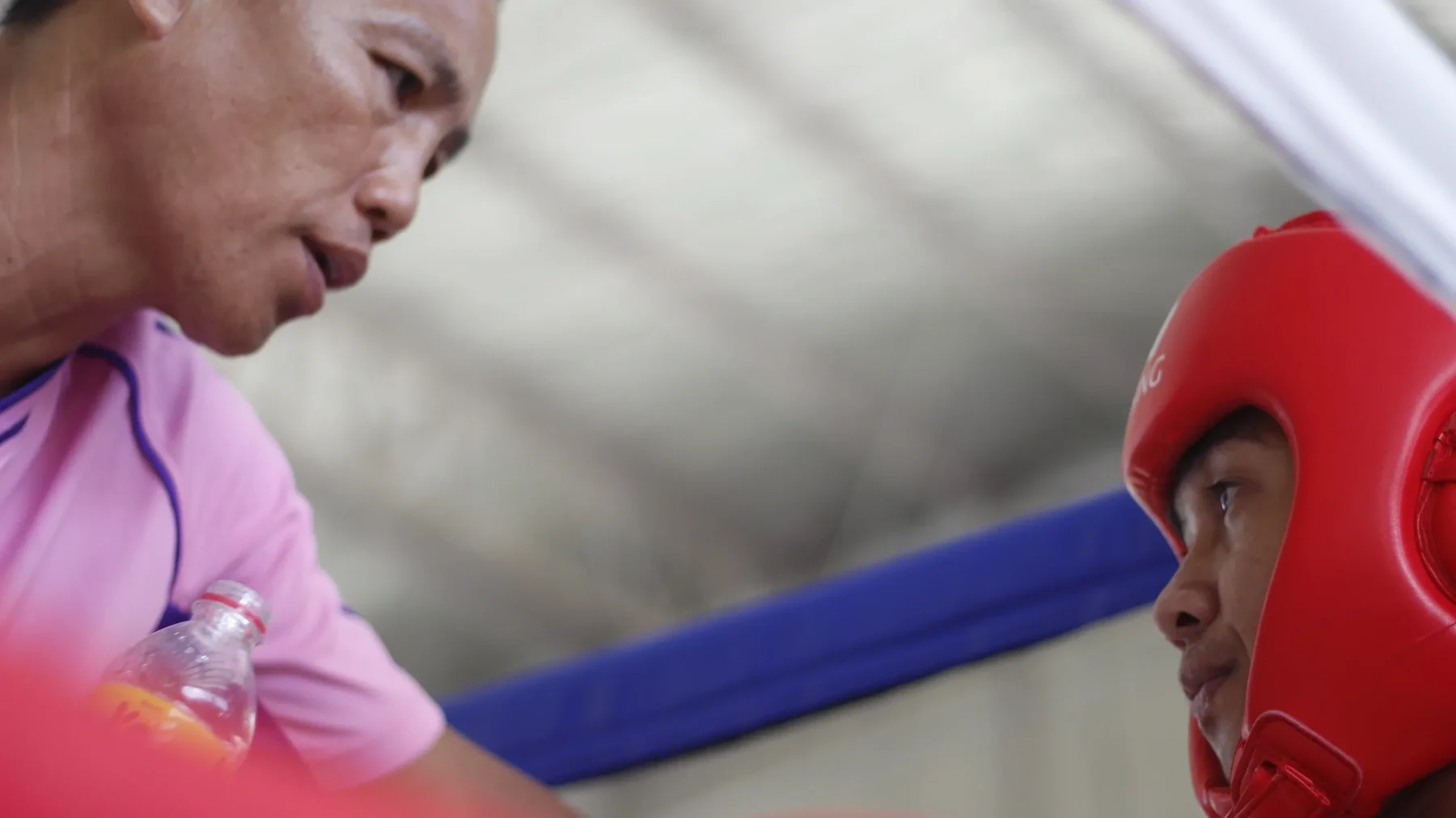 Ramon Fernandez speaking with a boxer