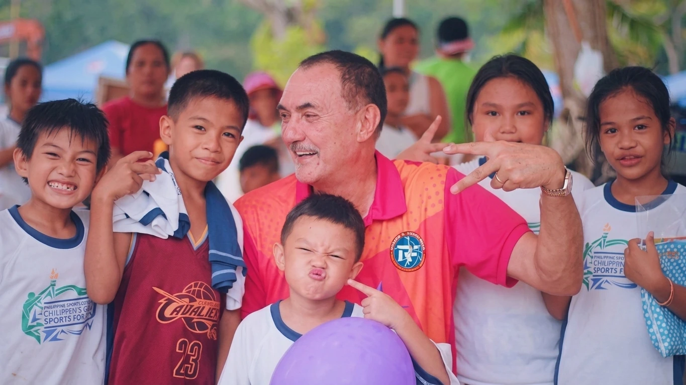 Ramon Fernandez sharing a playful moment with children