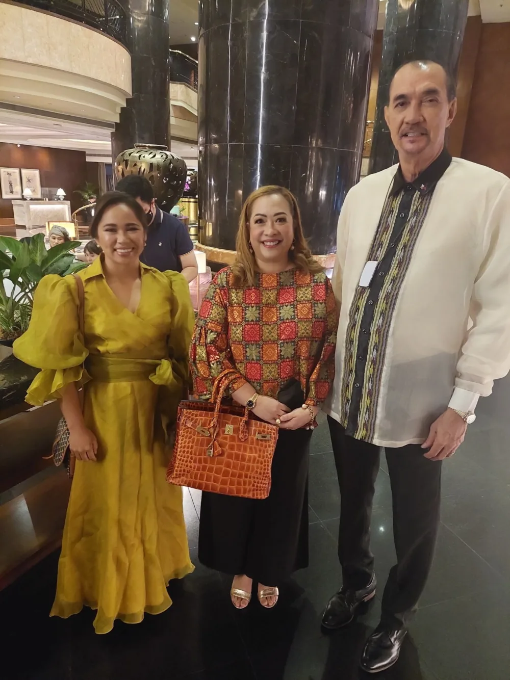Ramon Fernandez with guests at a formal gathering